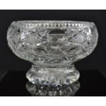 A cut glass bowl with footed base.