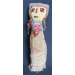 An early Peruvian doll, made out burial cloths, 28cm high.