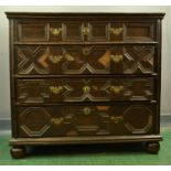 An 18th century oak geometric moulded chest of drawers, with four long graduated drawers, 96 wide,