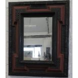 A 17th century style Venetian mirror, with an ebonised ripple moulded frame, 50 by 40cm, inner