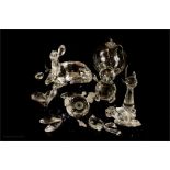 A group of Swarovski crystal; begging dog, tortoise, hedgehog. A/F