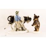 A Russian porcelain model of a cow and a bear.