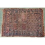 An antique prayer rug 105 by 148cm.