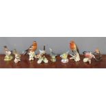 A group of Royal Doulton, Goebel, Royal Worcester birds etc.