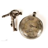 A silver pocket watch, 19th century, with engine turned decoration, and gilt decoration, with keys.