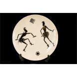 A Wade plate depicting African dancers.