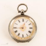 A ladies pocket watch, Roman numeral face and gold decoration.