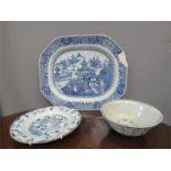 A group of blue and white ceramics including a Chinese bowl and meat plate.