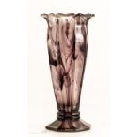 A glass vase, mottled design.