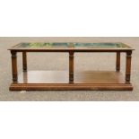 An oak coffee table with bevelled glass panels.