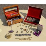 A group of costume jewellery within two jewellery boxes, to include brooches, rings, necklaces etc.