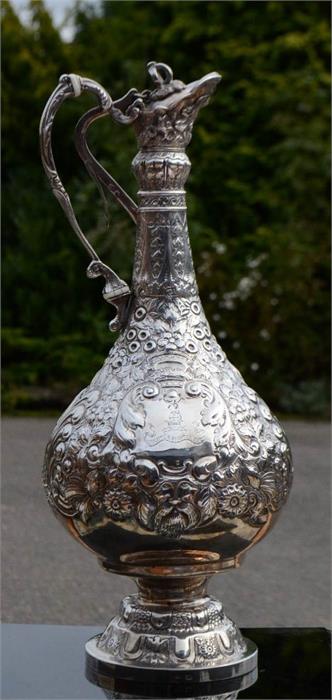 A silver claret jug, embossed with floral decoration, with presentation inscription to the front, - Image 5 of 7