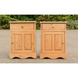 A pair of pine bedside cupboards.