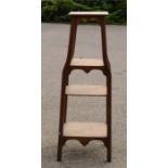 A four tier graduated oak stand.