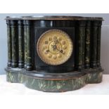 A Victorian mantle clock, ebonised, with simulated marble columns and arabic gilt metal dial.