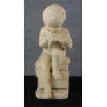 A 19th century Italian carved figure of a young boy writing, Canova engraved to the book, 41cm high.