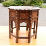 An Anglo Indian occasional table, with octagonal top, inlaid with ivory and ebony.