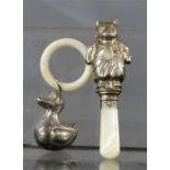 A silver Victorian and mother of pearl teether in the form of a cat, together with a duck form