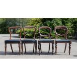 A group of four Victorian balloon back mahogany chairs.