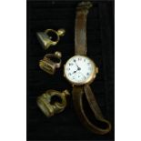 A 9ct gold cased wristwatch circa 1940 with leather strap together with three seal fobs.