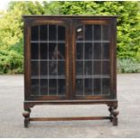 A 1940s china cabinet with glazed doors.