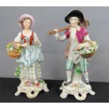 Two German porcelain figures, carrying baskets of flowers, 23cm high.