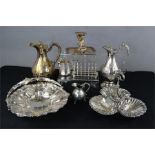 A group of silver plateware to include embossed bon bon dish, jugs, toast rack, chamber stick etc.