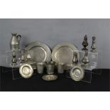 A group of pewter to include plates, jugs, dishes, shakers etc.