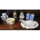 A pair of German porcelain miniature figures, together with a pair of blue and white jars, sifter,