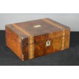 A Victorian rosewood box inlaid with mother of pearl to the top and parquetry bands.