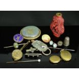 A group of miscellaneous items including cinnabar snuff bottle, lockets, Victorian brooch, hat pins,