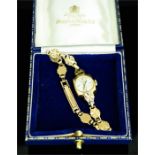 A 9ct gold Accurist ladies wristwatch, 10.64toz.