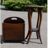 An oak magazine rack, and a small carved table in the black forest style.