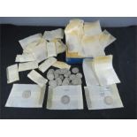 A quantity of various coins, including GB, some silver etc, each in collectors sleeves.