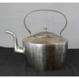 A large steel kettle.