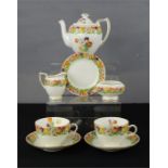 A Royal Doulton tea for two set, hand painted with flowers.