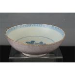 A Manganese bowl, with blue and white interior depicting a flower.