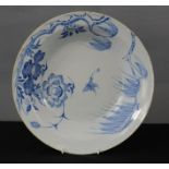 A Delft blue and white dish, 18th century, decorated with floral pattern.