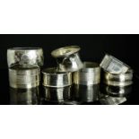 Seven silver napkin rings, of various style and form, 3.96toz.