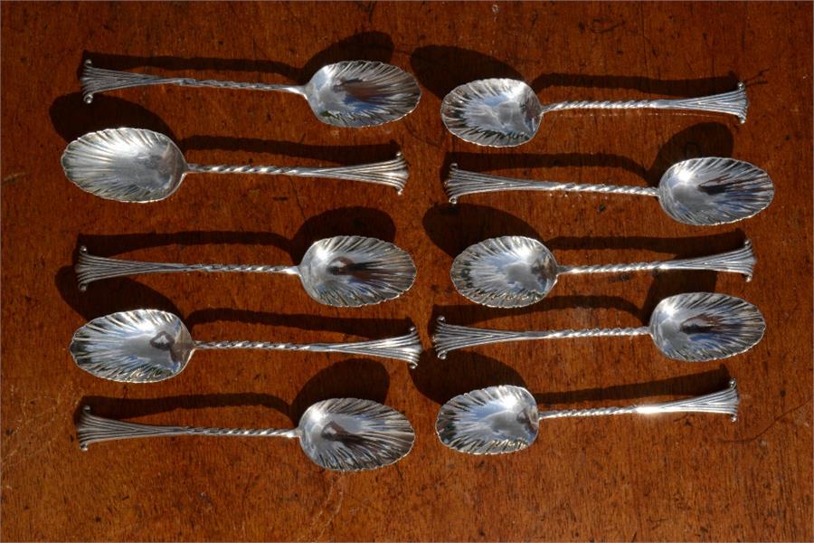 A group of ten silver spoons, of scallop form, 4toz.