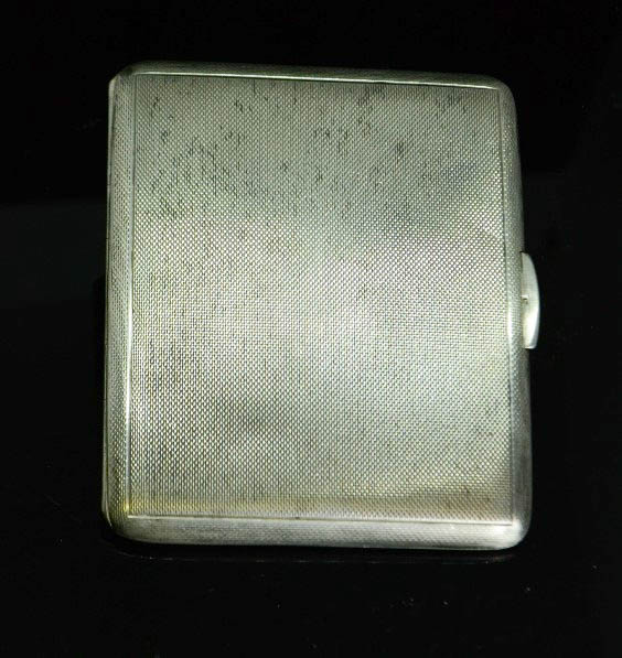 A silver cigarette case, machine engraved decoration, and a gilt interior, 4.04toz.