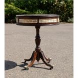 A small drum table, mahogany, tripod base.