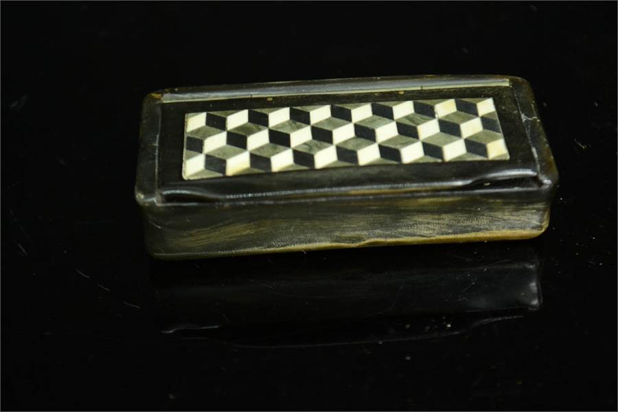 A 19th century horn snuff box with tumbling block design inlaid to the lid, 77 by 37mm - Image 2 of 3