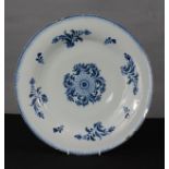 A late 18th century blue and white Delft charger, with floral pattern.