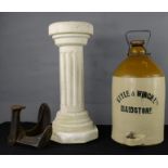 A stoneware glazed jar, shoe last and a plaster work column.