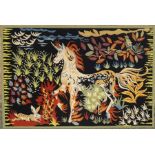 A hand woven tapestry panel, depicting a unicorn.