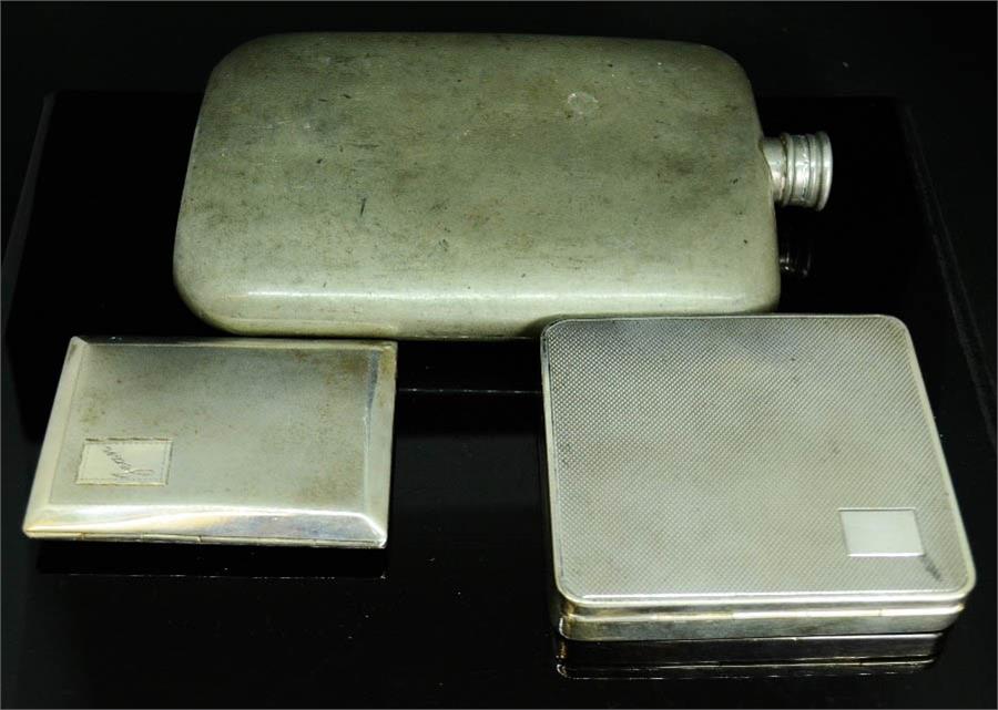 An early pewter hip flask, two silver plated cigarette cases. (3)