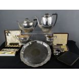 A group of silver plate including a tea set comprising tea pot, hot water pot, slop bucket, milk