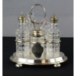 A silver plated cruet set with monogram to the shield plaque front.