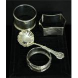 Three silver napkin rings, and a jam spoon, 2.37toz.